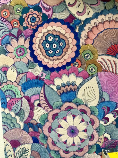 Intricate floral line drawings in pinks and blues.