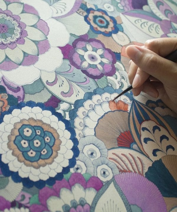 The Japanese artist Keiko Yanagisawa at work, creating her intricate floral designs.