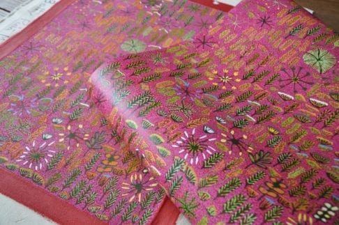 Aboriginal artwork on canvas with corresponding wallpaper design.