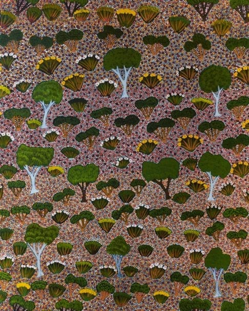 Native trees and flora of the Australian Outback captured in an Aboriginal dot painting wallpaper design.