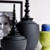 Matt and gloss black Thai decorative lidded pots in two sizes.