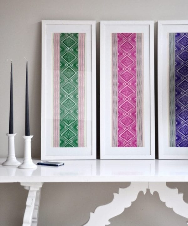 Magenta pink wall art created from a hand-loombed Thai textile sourced in northern Thailand. Also available in Pea green and Regal purple.