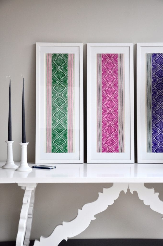 Magenta pink wall art created from a hand-loombed Thai textile sourced in northern Thailand. Also available in Pea green and Regal purple.