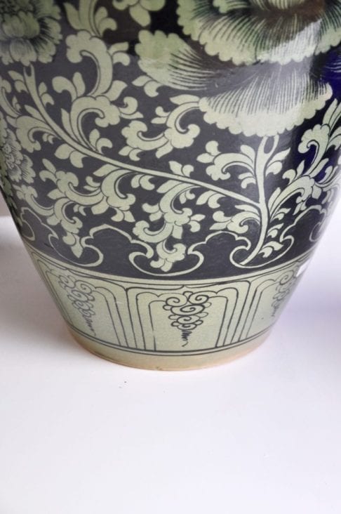 Typically Thai motifs adorn a hand-painted celadon pot from northern Thailand.