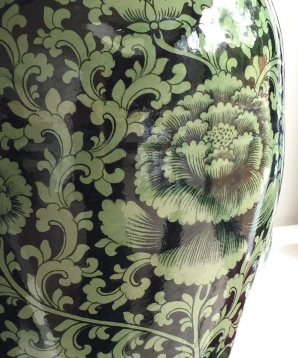 Detail of a hand-painted, glazed celadon pot from northern Thailand.