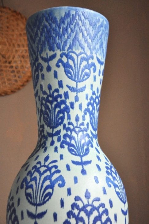 Close-up shot of a blue, hand-decorated pot from a pottery in Chiangmai, northern Thailand.