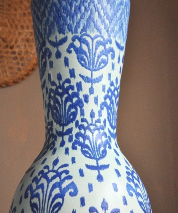 Close-up shot of a blue, hand-decorated pot from a pottery in Chiangmai, northern Thailand.