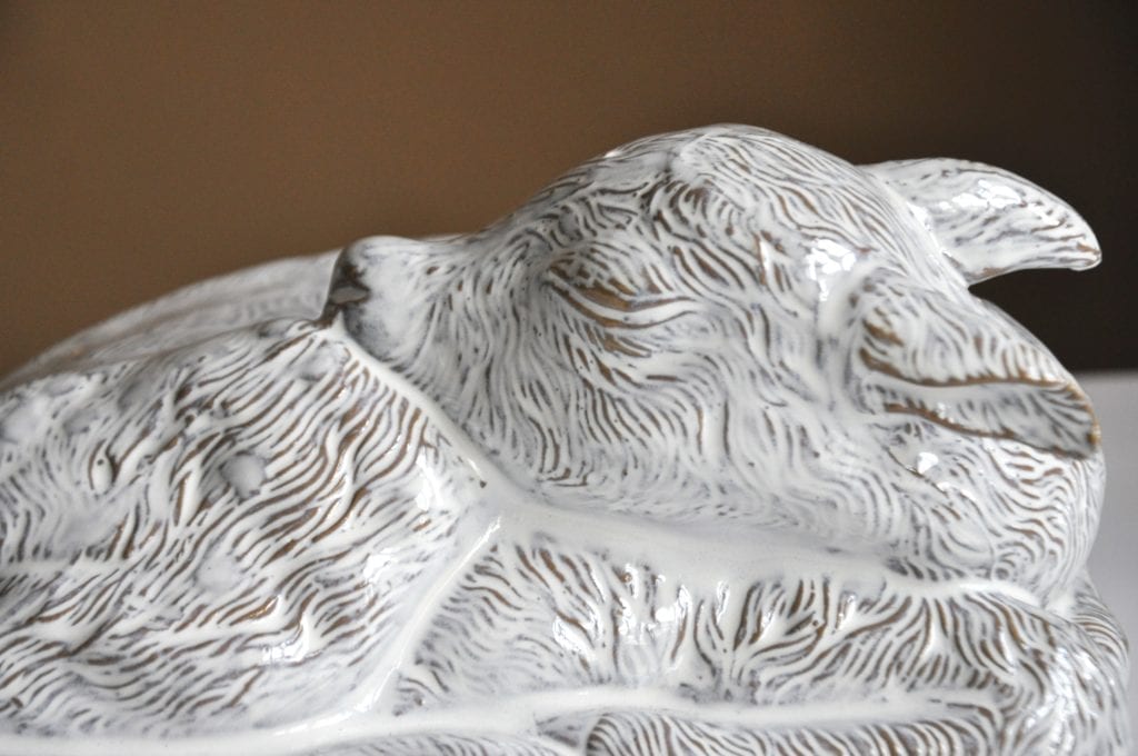 Charming facial features on a white-glazed ceramic fawn sculpture by Yarnnakarn, Thailand.