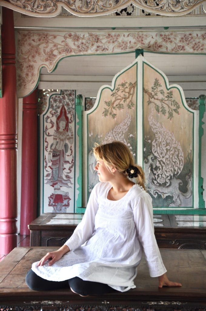 A snapshot of me in a painted traditional Thai house on water at Ancient Siam city park in Thailand.