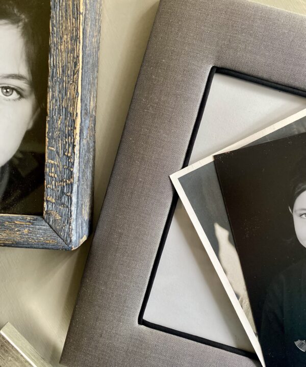 A grey silk photo frame handmade in Thailand.