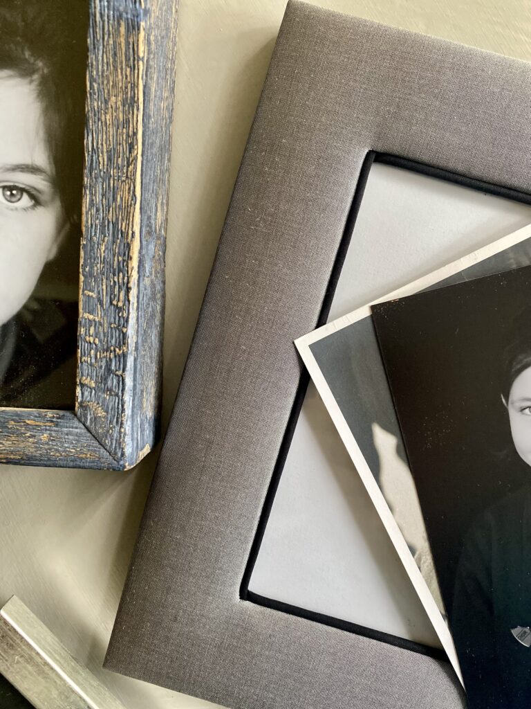 A grey silk photo frame handmade in Thailand.