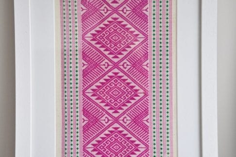 Magenta pink Thai textile wall art.