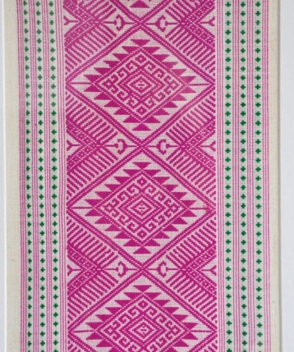 Magenta pink Thai textile wall art.