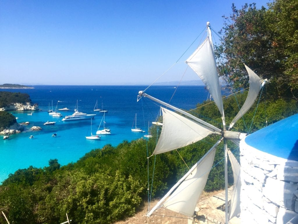 The view from a hilltop taverna looking acros Voutumi beach bay in Antipaxos, Greece.