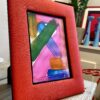 A Poppy red silk photograph frame handmade in Thailand.