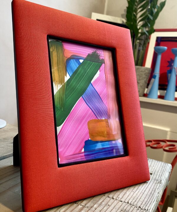 A Poppy red silk photograph frame handmade in Thailand.
