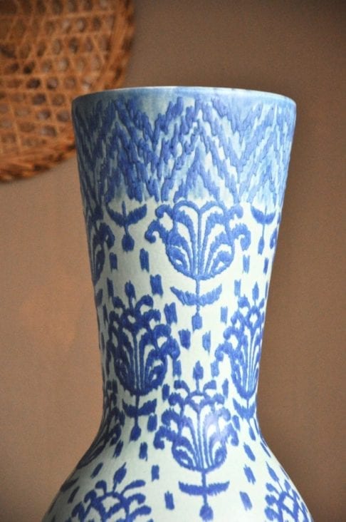 The top of a tall, blue on blue, hand-decorated ceramic pot from Chiangmai, northern Thailand.