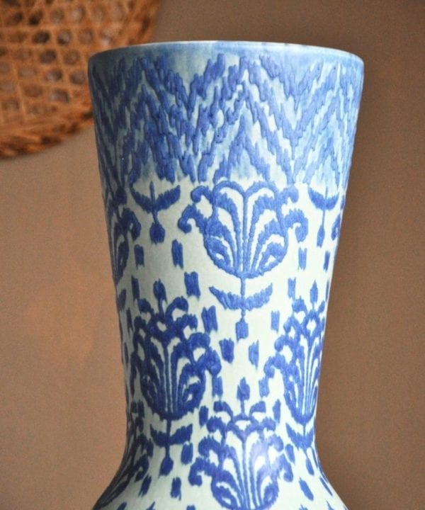 The top of a tall, blue on blue, hand-decorated ceramic pot from Chiangmai, northern Thailand.