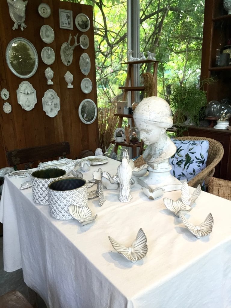 A variety of elegant busts, sculptures, wall plaques and decorative accessories displayed at the Yarnnakarn ceramics studio in Bangkok, Thailand.