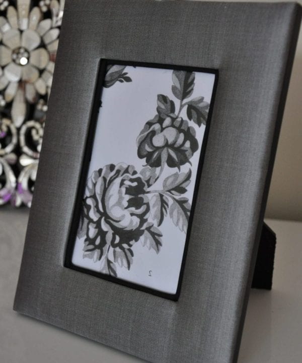 A smart, grey photo frame handmade in Thai silk.