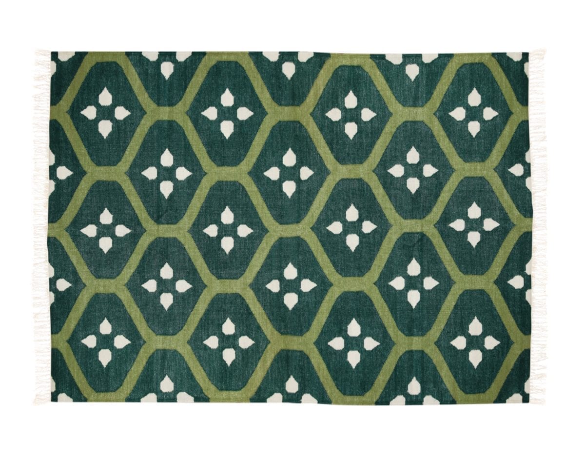 Green patterned Indian flat weave rug.