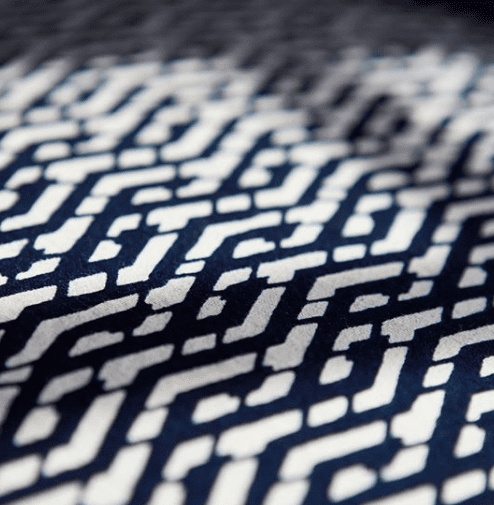 Detail of the indigo Eastern lattice print cushion fabric from Blue Handed through Telescope Style.