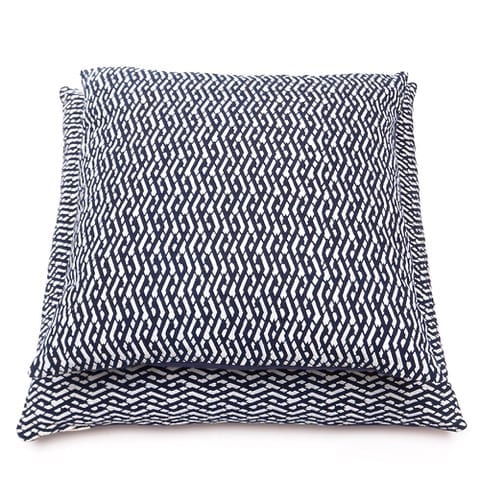 Indigo blue cushions in two sizes showcasing a typical Chinese lattice design, handmade using the ancient art of relief printing.