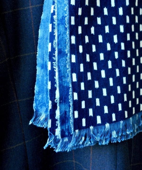 Close-up of a handmade indigo blue scarf.