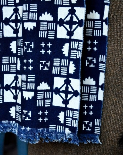 Close-up of an indigo blue geometric print scarf.