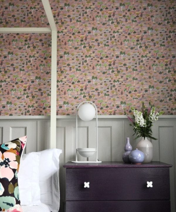 Pink trees and botanicals Aboriginal pastel wallpaper in a bedroom.