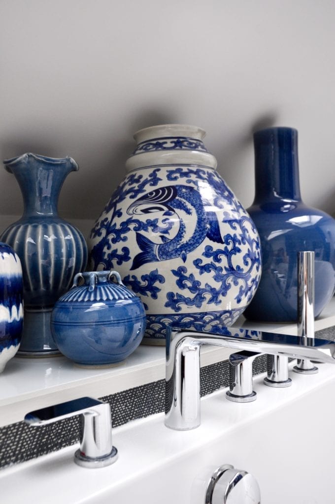 Blue and white Asian pottery in a modern bathroom.