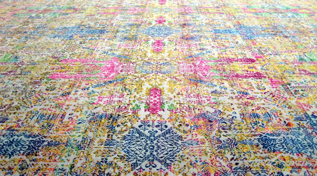 A modern, multi-coloured Persian-style rug design.