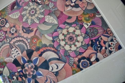 Detail of a floral Japanese drawing limited edition print in a palette of pinks, purples and greens.