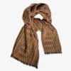 A luxury cashmere and cotton mix wide scarf in beiges and browns with a geometric weave.