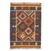 An Aztec-inspired rug with diamond pattern in mustard and brick red with tasselled ends.