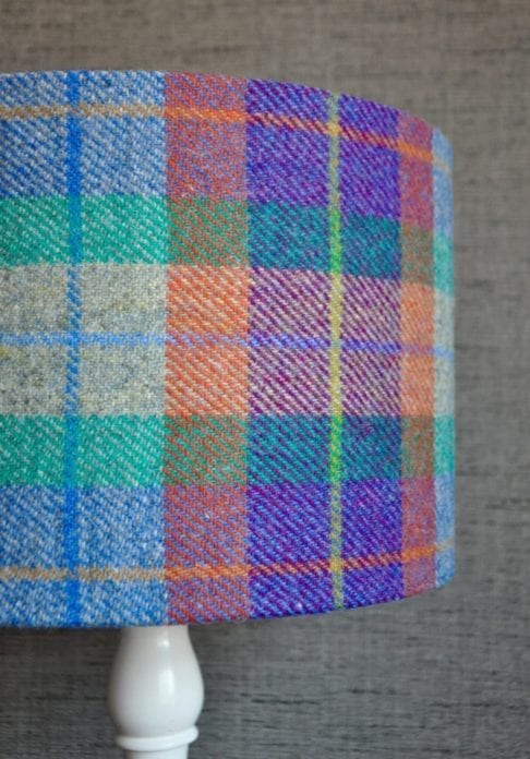 A shot of a colourful Harris tweed check drum shade available to order through Telescope Style.