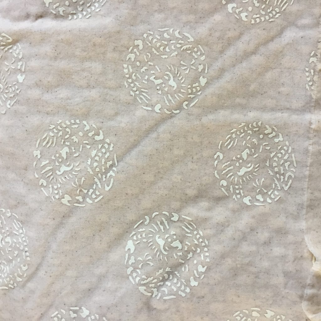 Hand cut decorative patterns ready to be applied to the cotton calico fabric.