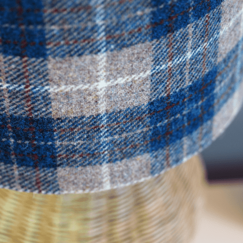 Detail of a blue check Harris tweed lampshade.