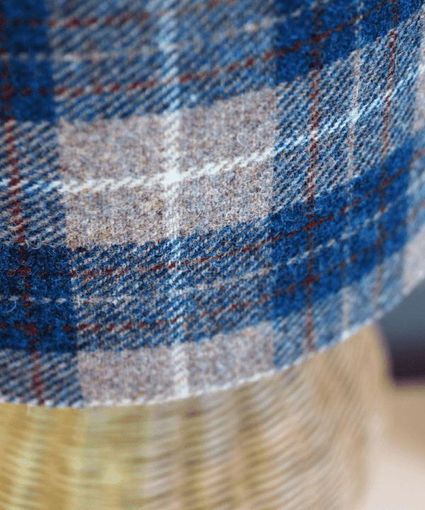 Detail of a blue check Harris tweed lampshade.