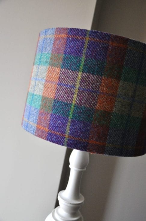 A purple, orange , green and yellow Harris tweed check lampshade.