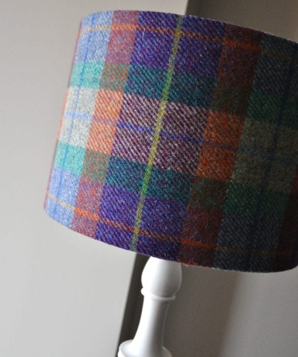 A purple, orange , green and yellow Harris tweed check lampshade.