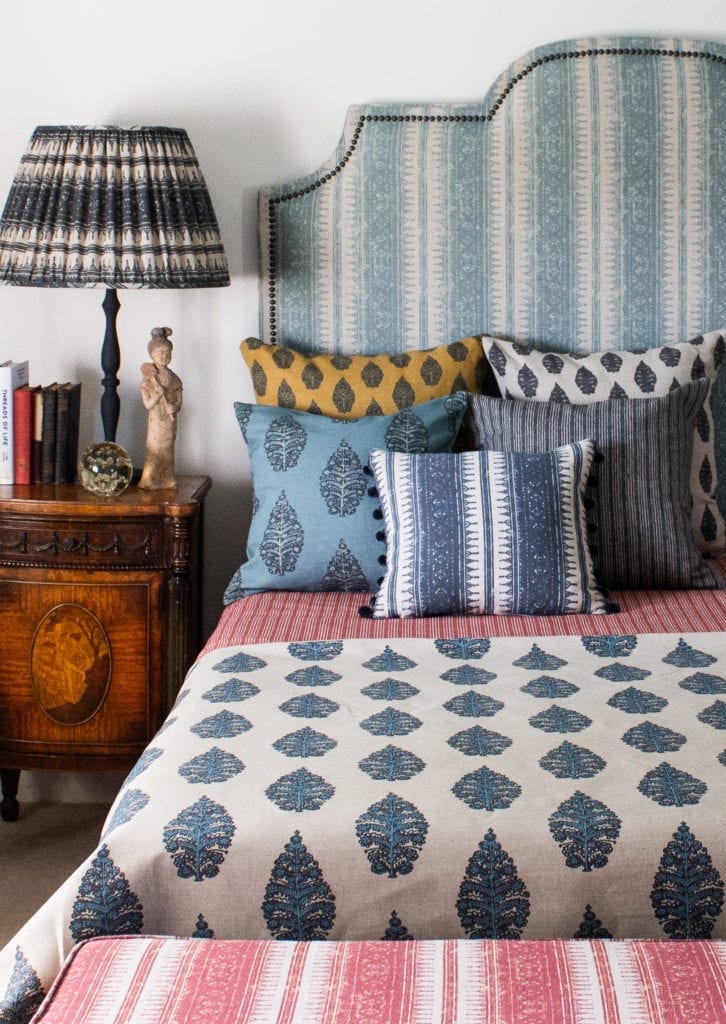 A collection of fabrics styled on a bed, all by textile designer Julia Brendel.