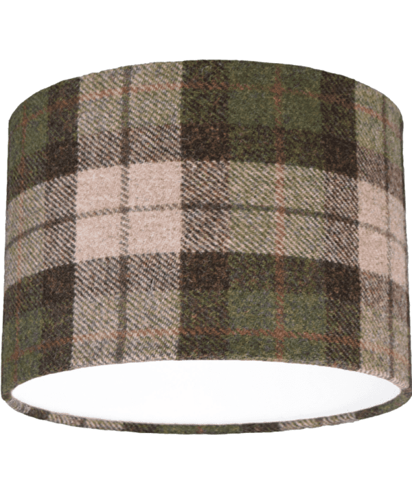 Cut out shot of a black, red and moss green check drum shade made from Harris Tweed.