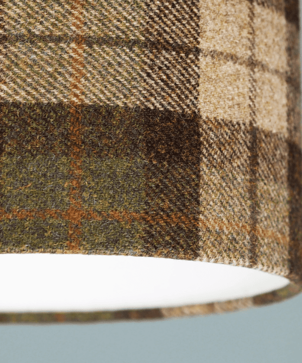 Detail of a Moss green check Harris tweed lampshade.