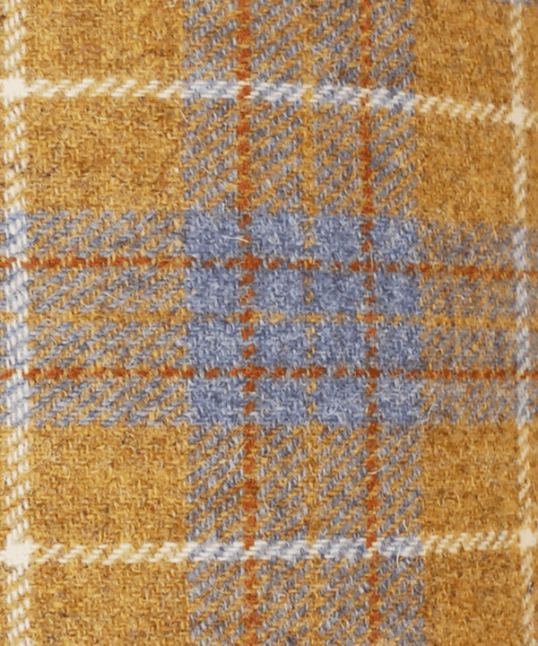 Close up shot of a Harris tweed check mustard drum shade.