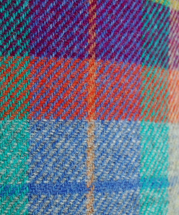 Detail of a brightly coloured Harris tweed check drum shade in purple, orange, turquoise and baby blue available through Telescope Style.