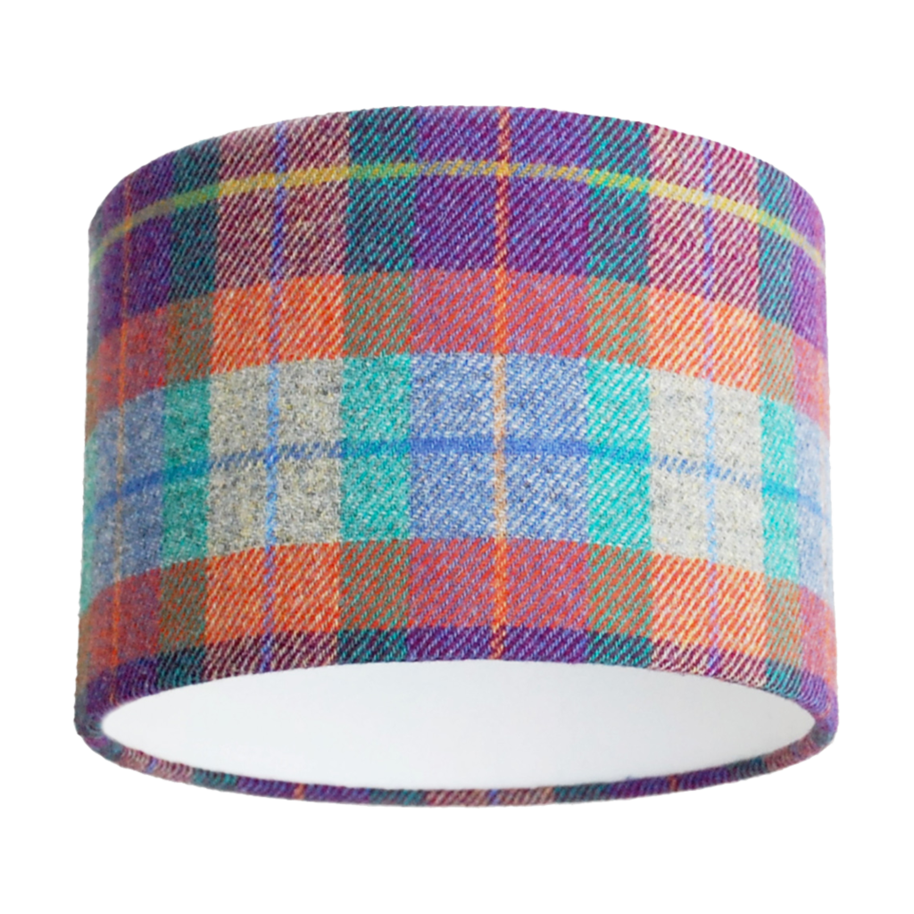 A cut out image of a Harris tweed check drum shade in zingy purple, orange, pale blue and turquoise from Telescope Style.