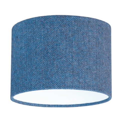 Cut out shot of a blue tweed drum shade with herringbone weave.