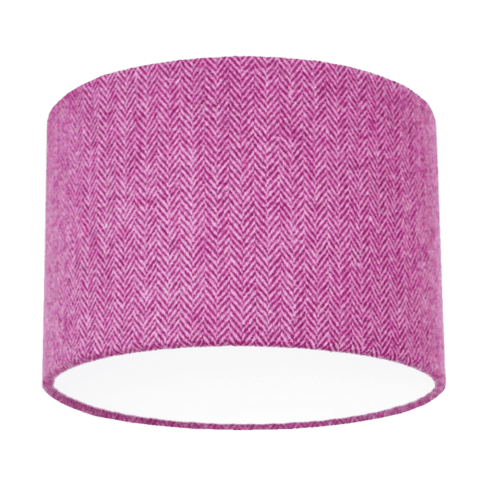 Cut out shot of a pink tweed drum shade with herringbone weave.