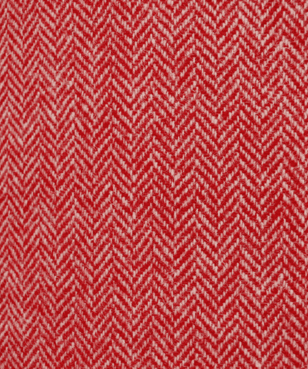 Detail of the herringbone pattern on a red tweed lampshade from the Isle of Harris.